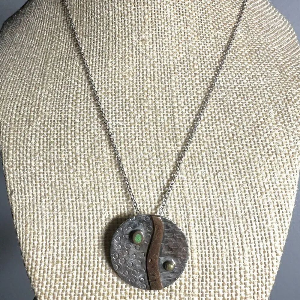 Silver tone and copper round pendant necklace